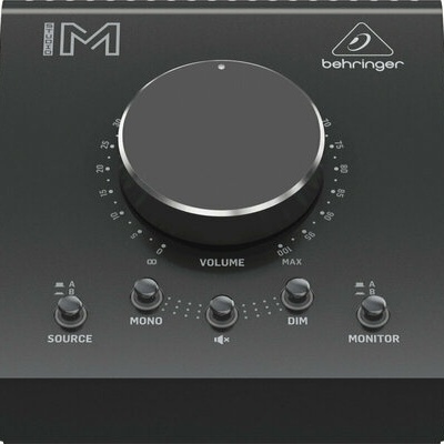 Interface de áudio Behringer preta com botões e volume grande circular