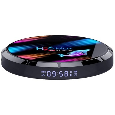 aparelho eletrônico redondo com visor digital frontal e topo colorido com texto H96 Max