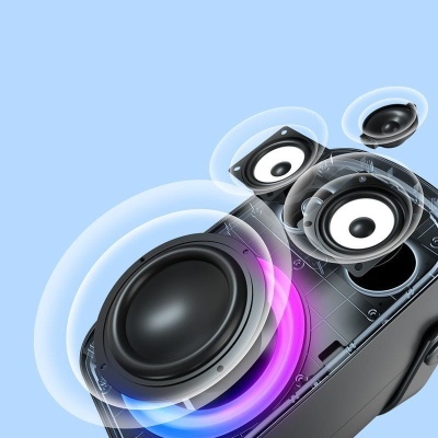 Coluna de som preta com altifalantes visíveis e anéis coloridos a sair