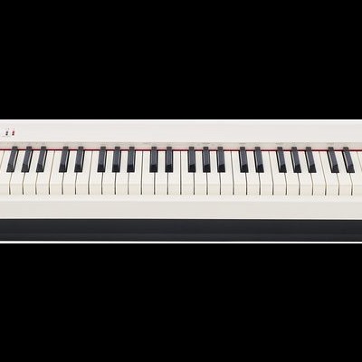 Piano digital branco com teclas e texto STUDIOLOGIC no centro superior