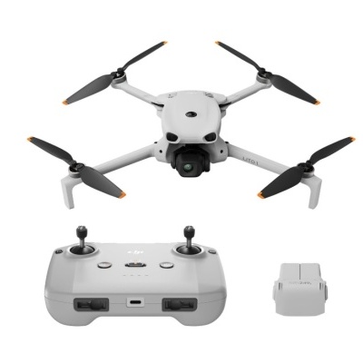 Drone cinzento com controle remoto e bateria cinzenta