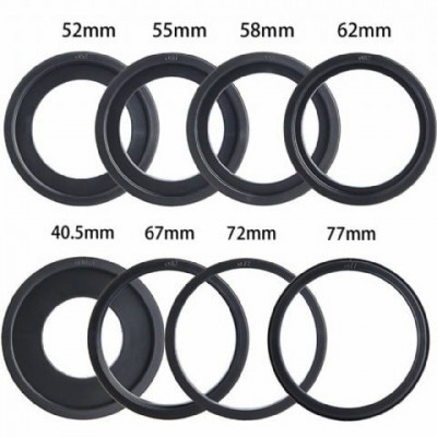 Oito anéis adaptadores de objetivo de várias medidas em milímetros sobre fundo branco.