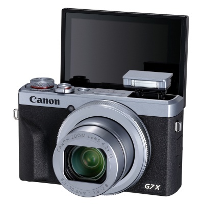 Câmera fotográfica Canon G7 X com lente prateada e ecrã articulado aberto