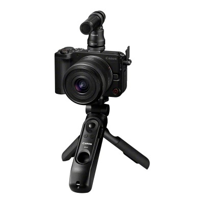 Câmara Canon preta com tripé pequeno e microfone direcional