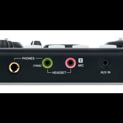 Dispositivo preto com portas de áudio e botão lateral