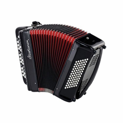 Acordeão preto com fole vermelho e preto e botões brancos.