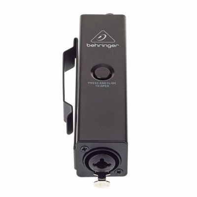 Dispositivo electrónico preto Behringer com botão e conector circular