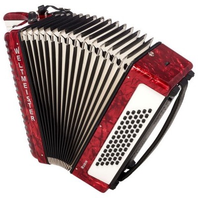 Acordeão vermelho com botões e teclas, texto WELTMEISTER na lateral