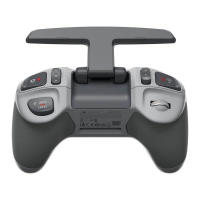 Comando de videojogo cinzento e preto com suporte para telemóvel