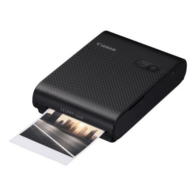 Impressora portátil Canon a imprimir fotografia de paisagem urbana