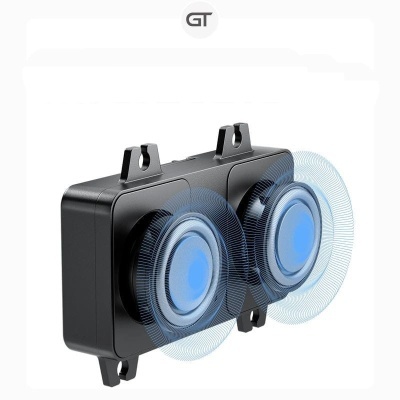 Caixa de som preta com dois alto-falantes azuis e efeito visual de som em ondas azuis