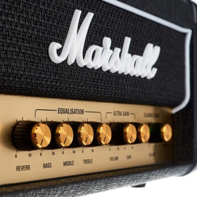 Amplificador Marshall preto com painel dourado e botões de controle