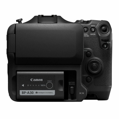 câmara fotográfica Canon preta vista de trás com ecrã e bateria visíveis