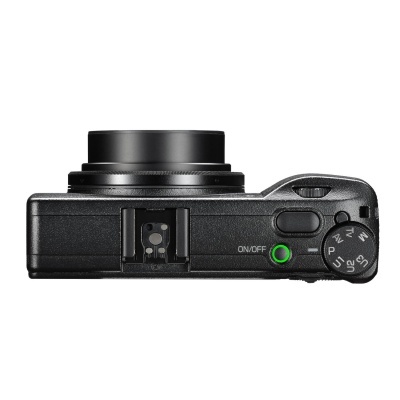 Câmara digital compacta preta vista de cima com lentes retráteis e botões