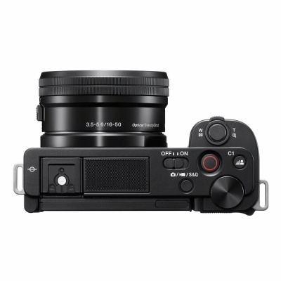 Câmara digital preta vista superior com lente destacada e vários botões de controlo