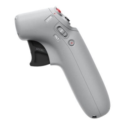 Controlador remoto cinzento com botões e interruptores visíveis