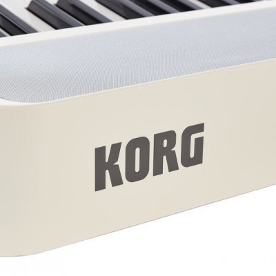 Parte de teclado musical Korg branco e preto com corpo branco e teclas
