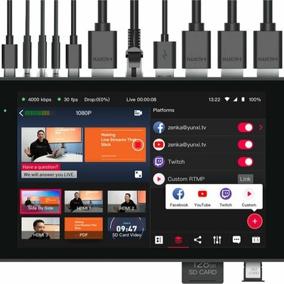 Dispositivo preto com ecrã tátil mostrando interface de transmissão ao vivo e várias conexões no topo