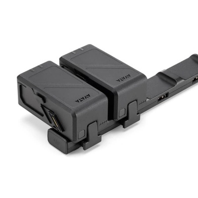 Suporte ajustável em plástico preto com texto 'NIKA'