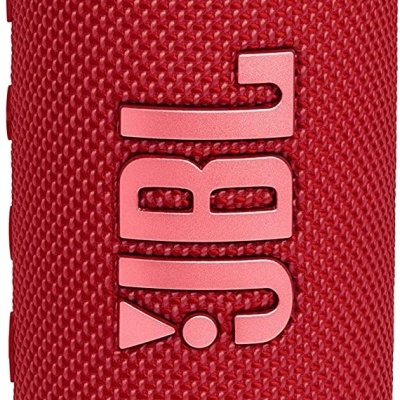 Coluna portátil de som JBL vermelha com textura em tecido e logótipo em relevo.