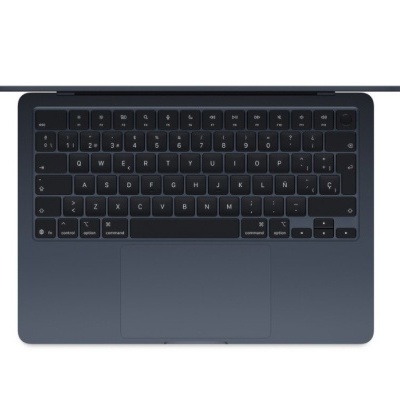 Portátil cinzento escuro visto de cima com teclado QWERTY espanhol e trackpad