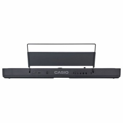 Teclado digital preto CASIO visto de trás com suporte para partituras