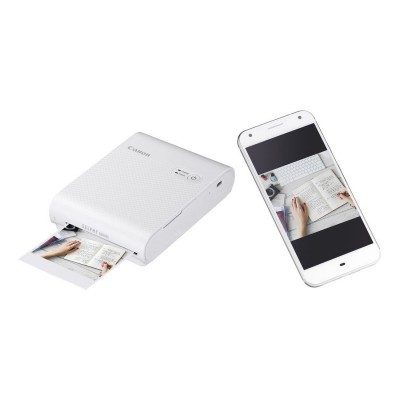 Impressora portátil Canon branca com smartphone branco exibindo a mesma imagem