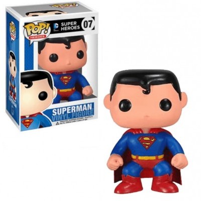 Figura vinil Superman em fato azul e capa vermelha ao lado da sua embalagem