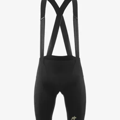 Calções de ciclismo pretos com alças elásticas e logotipo dourado.