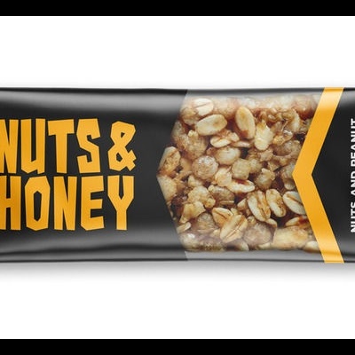 Barra energética preta BiotechUSA Nuts & Honey com nozes visíveis