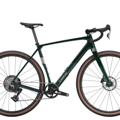 Bicicleta de estrada verde escuro com pneus castanhos e selim preto