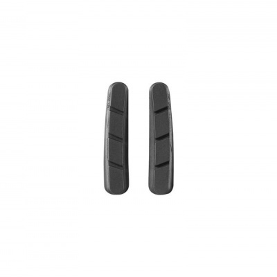 Dois calços de borracha cinza escuro com recortes em diagonal sobre fundo branco