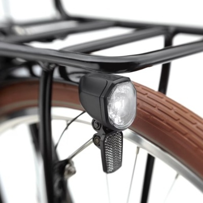 Luz dianteira preta numa bicicleta com pneu castanho e estrutura preta