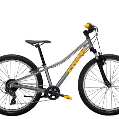 Bicicleta de montanha TREK cinza com detalhes amarelos, pneus pretos largos e selim preto