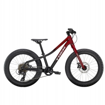 Bicicleta Trek vermelha e preta com pneus largos para criança