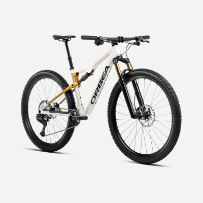 Bicicleta de montanha Orbea com quadro branco e dourado