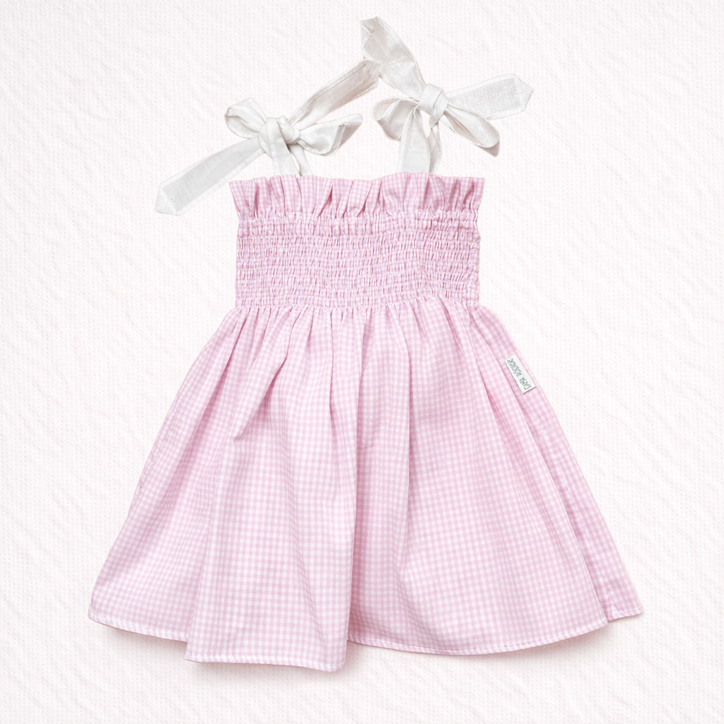 Vestido infantil cor-de-rosa xadrez com alças brancas em laço