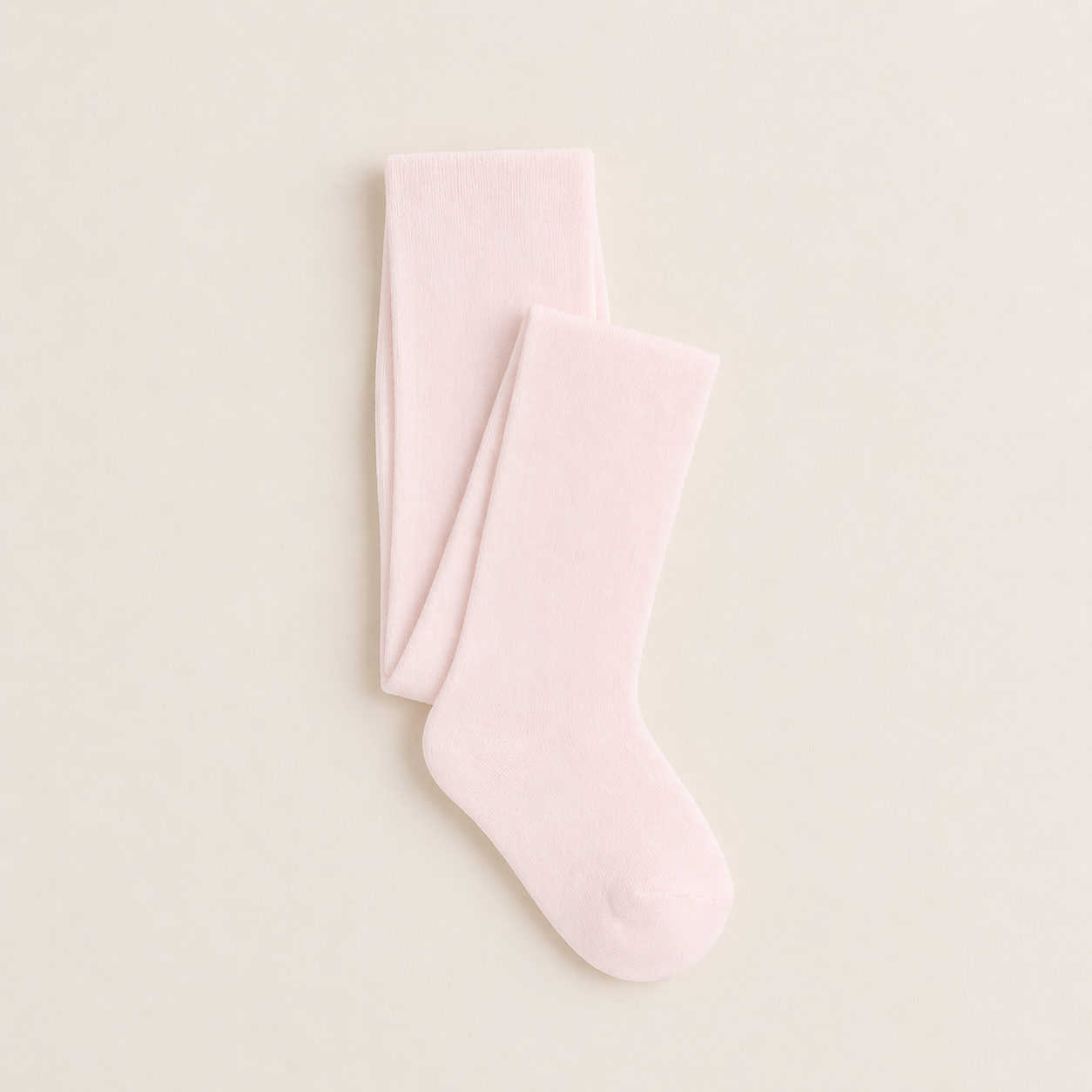 Meia-calça rosa clara lisa sobre fundo bege claro