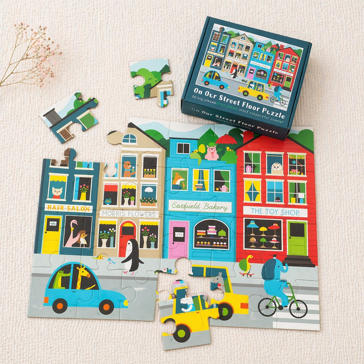 Quebra-cabeças infantil com ilustração de rua colorida e caixa do puzzle