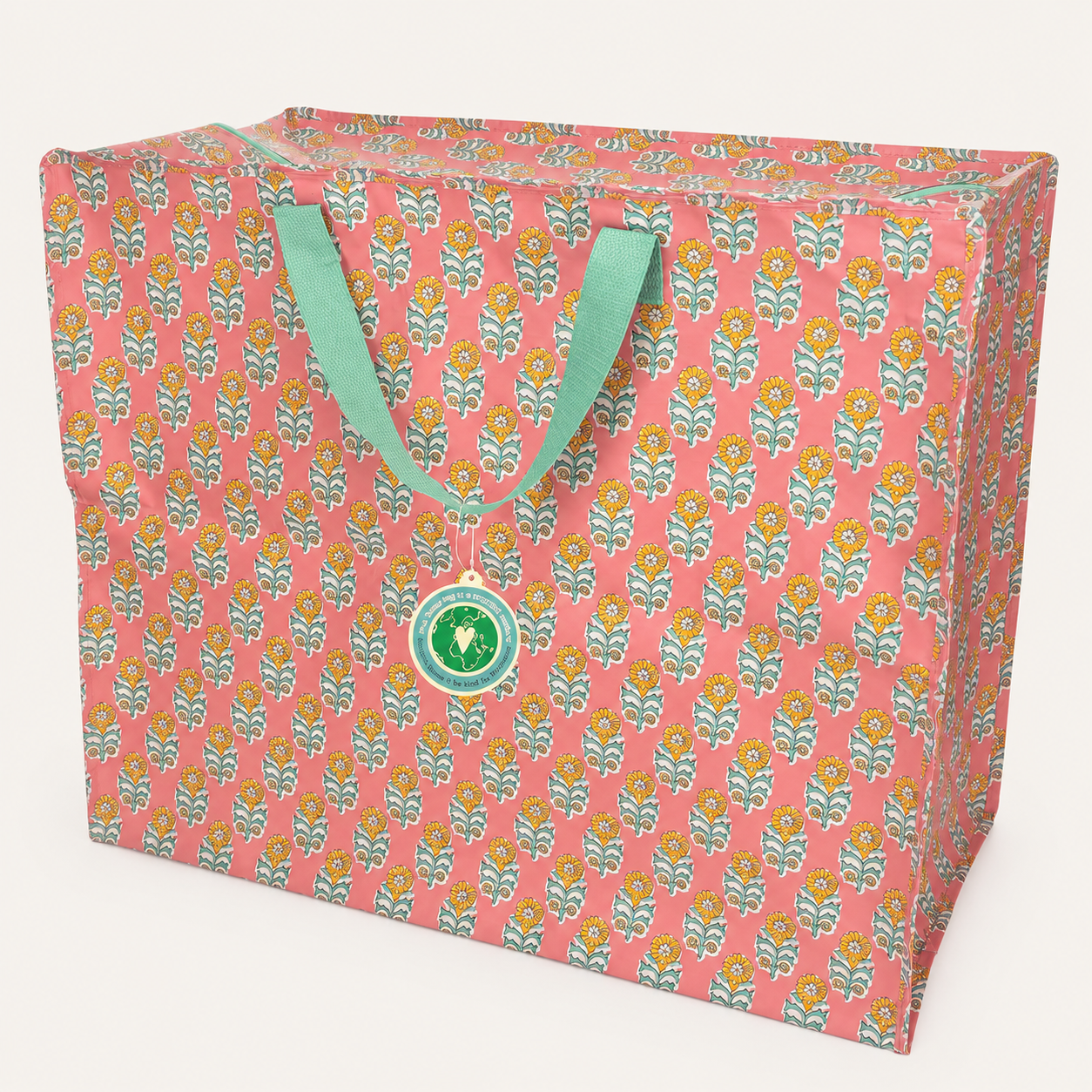 Saco tecido coral com padrão floral amarelo e verde e alças verdes