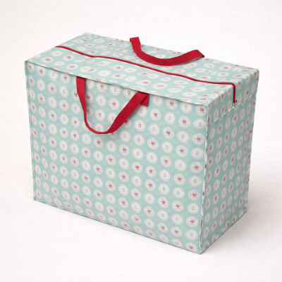 Saco de armazenamento azul claro com padrão circular e alças vermelhas