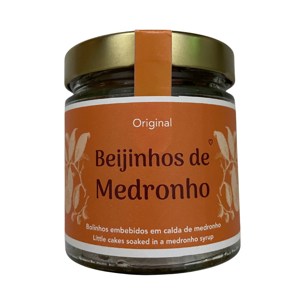Beijinhos de Medronho 9 Uni Frasco de vidro com tampa dourada e rótulo laranja de beijinhos de medronho