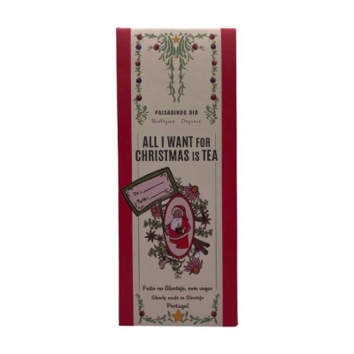 Embalagem de chá natalício com cores vermelho e bege e ilustração de Pai Natal.