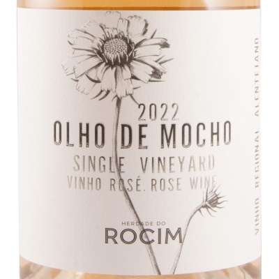 Etiqueta branca de vinho rosé com uma ilustração de flor e texto preto