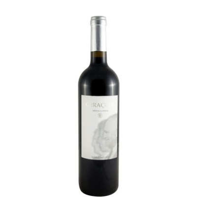 Garrafa de vinho tinto com rótulo branco e tampa prateada