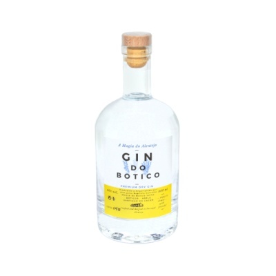 Garrafa de gin transparente com rótulo branco e amarelo
