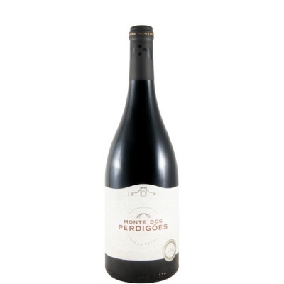 Garrafa de vinho tinto Monte dos Perdigões com rótulo branco e selo