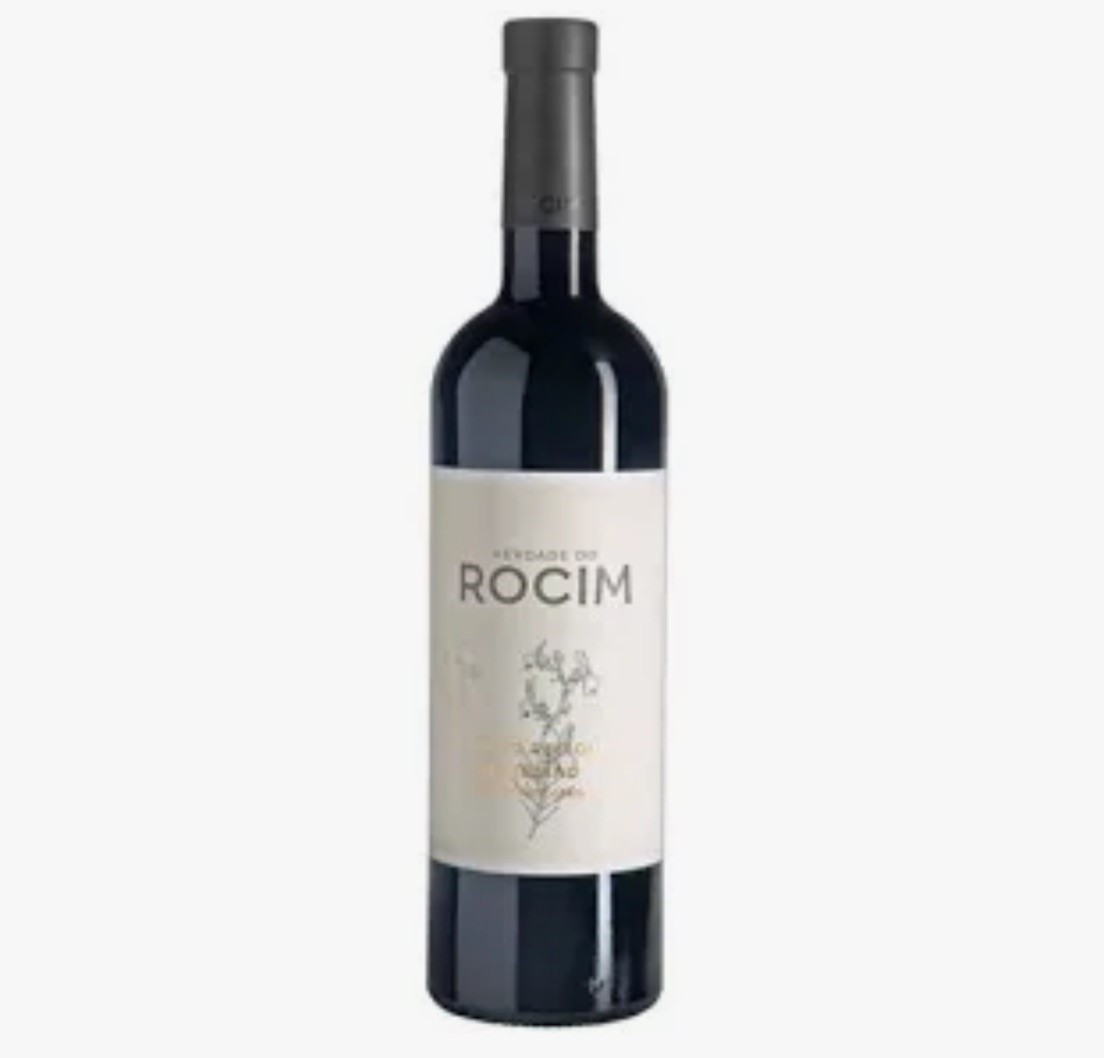 Garrafa de vinho tinto com rótulo branco e desenho botânico