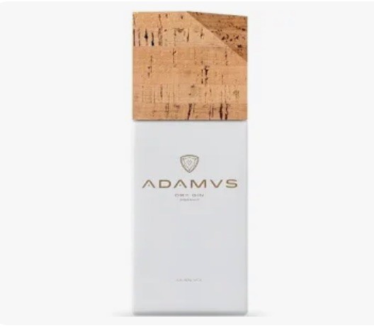 Frasco de perfume branco com tampa de cortiça e texto ADAMVS