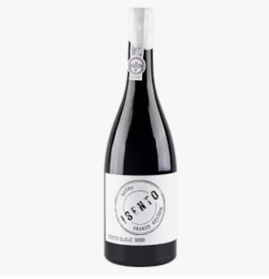 Garrafa de vinho tinto com rótulo branco e texto ISENTO PRIMUS RESERVA